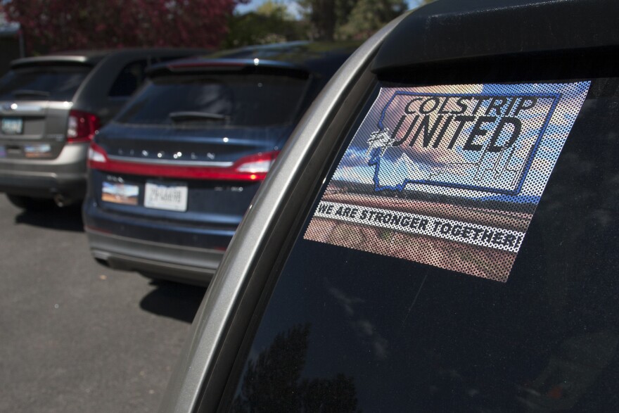 "Colstrip United" banners, posters and car stickers can be seen all around Colstrip, Mont. The group aims to elevate pro-coal voices in the larger debate about energy.