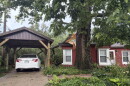 A tree fell on this house on Payne Place in Normal during Thursday's storms.