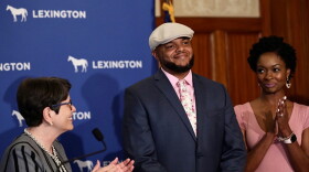 Devine Carama, the director of One Lexington, encourages nonprofits and other groups to apply for the city's gun violence prevention grants, which Mayor Linda Gorton, left, says are helping reducing shootings and homicides.