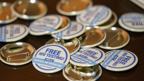 Free HIV testing buttons are shown at a roundtable on gender-affirming care and transgender health, Wednesday, June 29, 2022, in Miami. (AP Photo/Wilfredo Lee)