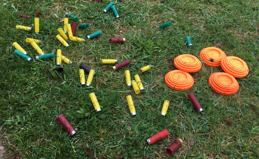 Empty shells and clay targets photo