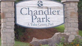 The welcome sign at the foot of the hill at Tulsa County's Chandler Park. The plane crashed on top of the hill.