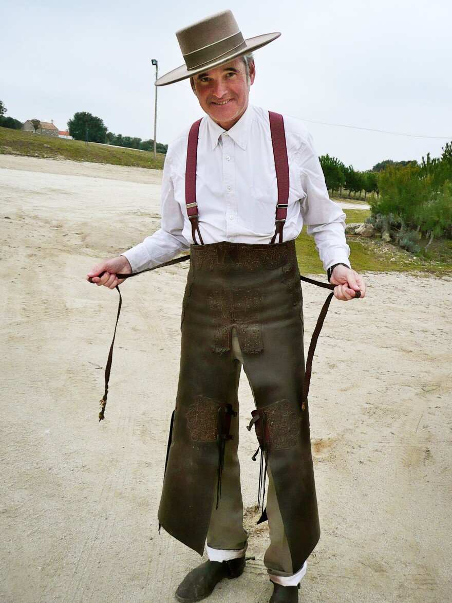 Jaime Patino shows off the leather chaps and 19th-century-style suit he wears while riding horses and hunting wild boar. Parts of his outfit belonged to his grandfather, who also loved hunting.