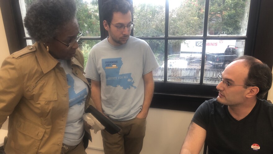 Peter Robbins-Brown (right) is coordinating the teams of canvassers about to head out door-to-door to educate voters about the unanimous jury constitutional amendment. Janice Long (left) will be canvass with Elias Newman (center).