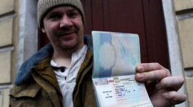 In St. Petersburg on Thursday, Greenpeace International activist Anthony Perrett, a British citizen, showed the Russian transit visa that's now in his passport.