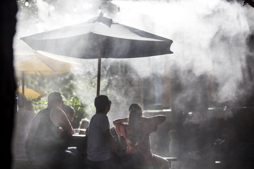  Water misters help patrons cool off in the summertime heat at Guero's Taco Bar in Austin.