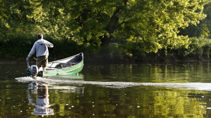 Mark Adams, a recreation manager for Katahdin Woods & Waters Recreation Area, motors down the East Branch of the Penobscot River after dropping hikers off at Big Seboeis River campsite in 2014.