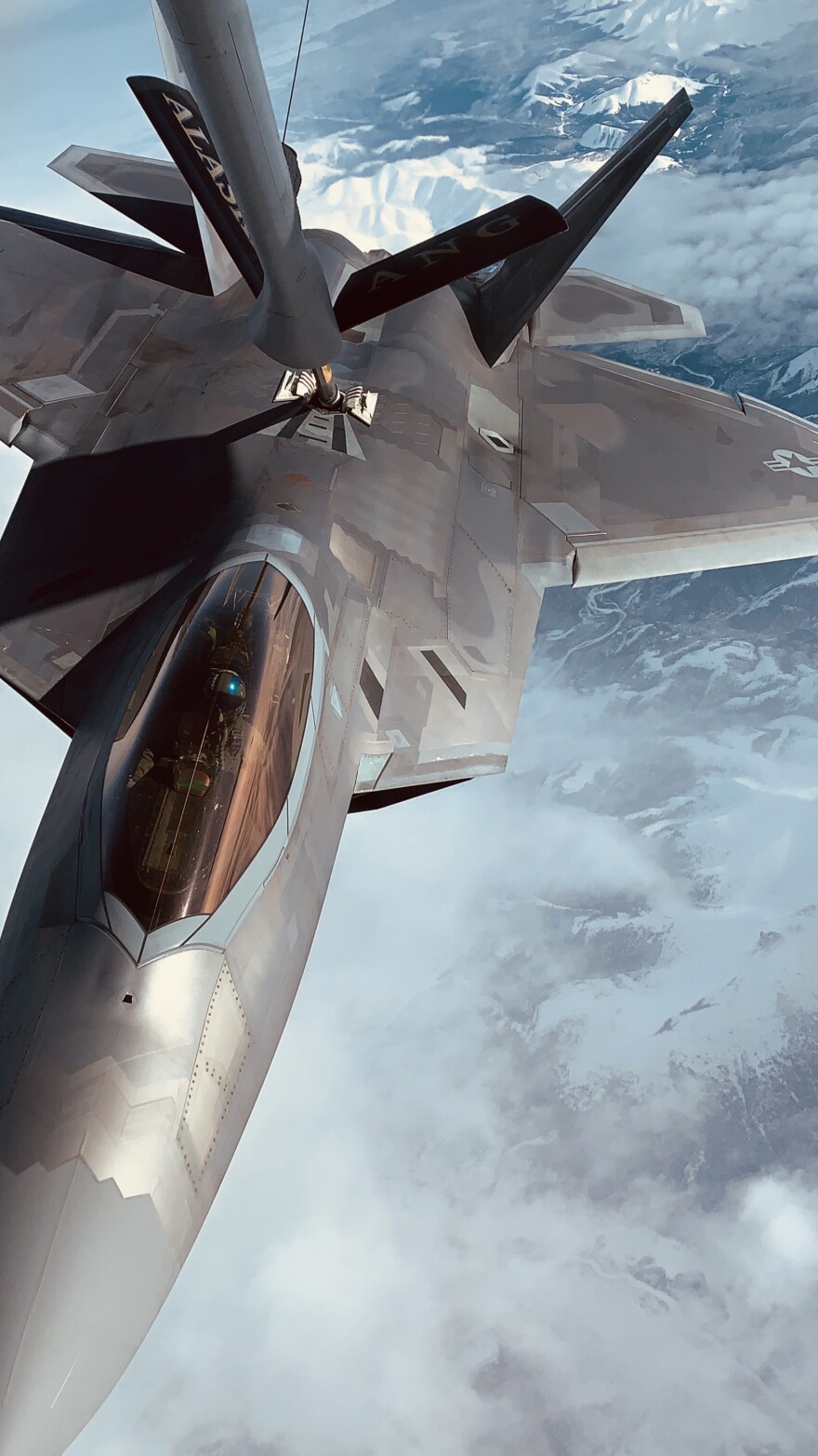 An F-22 Raptor from Joint Base Elmendorf-Richardson refuels mid-air using the boom of an Alaska Air National Guard 168th Wing KC-135. JBER's F-22s and Eielson's F-35s are part of what a Guard spokesperson calls 'one of the highest concentrations of 5th generation fighters anywhere in the world.”