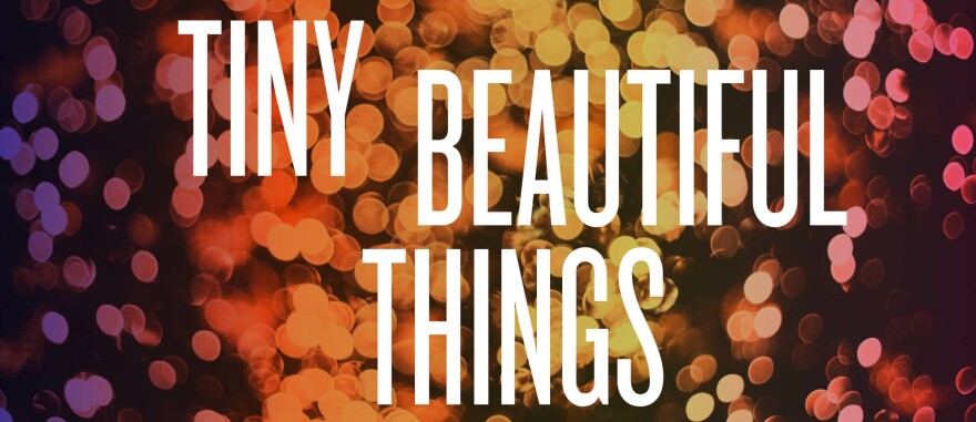 Artwork for "Tiny Beautiful Things" at Chester Theatre Company, title of show is in sans-serift white text. Background is purple to orange to yellow to pink gradient, left to right, of abstract light-like dots.