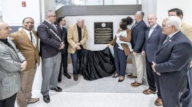 Virginia Beach Mayor Bobby Dyer, left of plaque, and council member Jennifer Rouse, right, unveil a Land Acknowledgement plaque  recognizing the Indigenous groups that lived for thousands of years on the land now known as Virginia Beach. The plaque was unveiled on Thursday, Feb. 5.