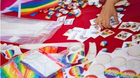  Pride flags, pronoun buttons and other merchandise are available at an Austin school district Pride event at Eastside Early College High School last year. 