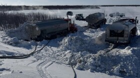 Fuel trucks operated by Bethel-based supplier Top Fuel deliver fuel to Tuntutuliak's power utility on March 11, 2026.