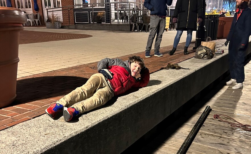 Calvin Broadhead lays next to a long pole he fished out of the Patapsco River on January 26.