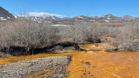A tributary of the Kugororuk River in northwest Alaska runs orange.
