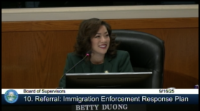 A screenshot of the Santa Clara County's Board Meeting. Supervisor Betty Duong smiles behind a microphone, with bottom text reading: "Board of Supervisors 9/16/25, 10. Referral: Immigration Enforcement Response Plan"