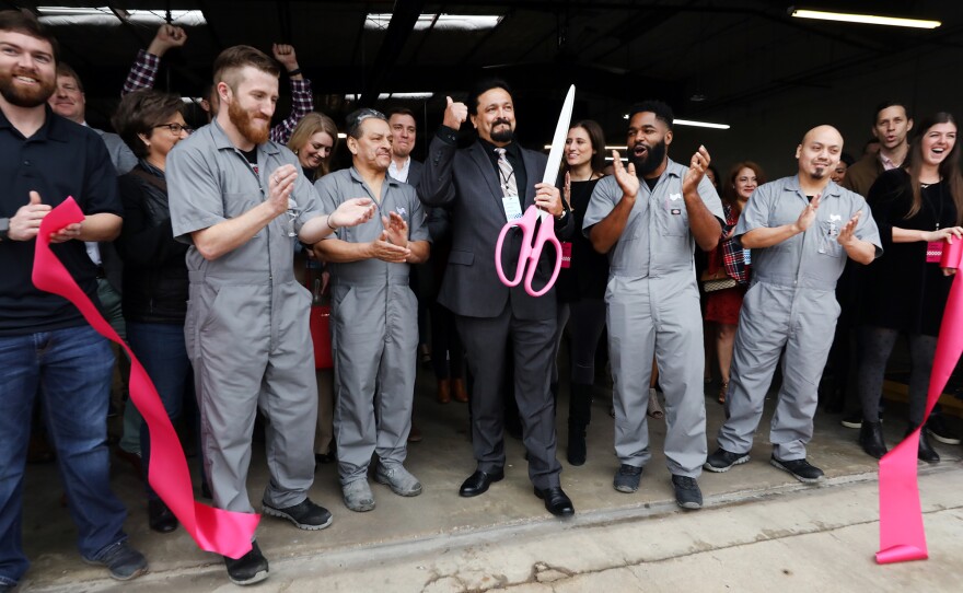 Austin Lyft Driver cuts the ribbon at the Austin Driver Center grand opening.