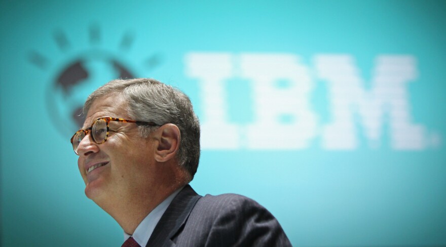 <strong>Reason To Smile:</strong> Samuel Palmisano, president and CEO of IBM, walks by an IBM logo at the CeBIT technology fair in Hanover, Germany. Palmisano is set to step down later this month, and Virginia Rometty will take over on Jan. 1.