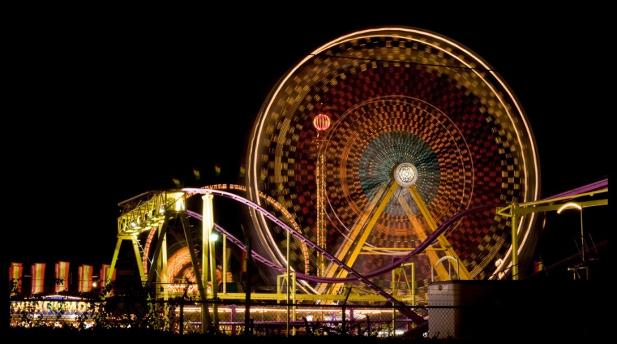 The South Carolina State Fair's midway rides at night.