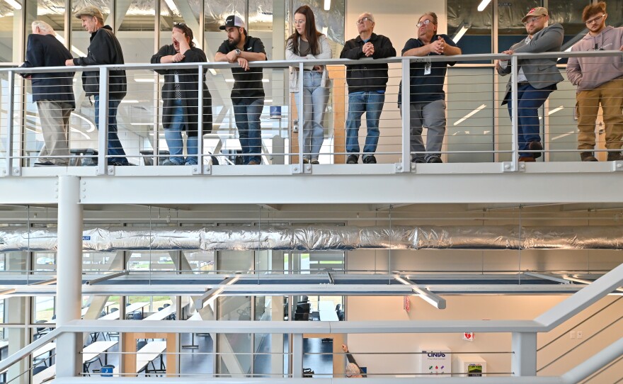 People watch and listen from the second floor of the Ideal Saldi Hall.
