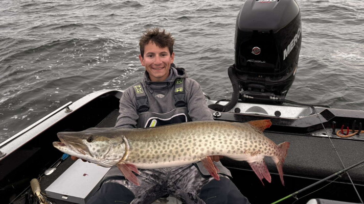 Bemidji State University graduate student Baylor Short shows a muskie caught on Leech Lake.