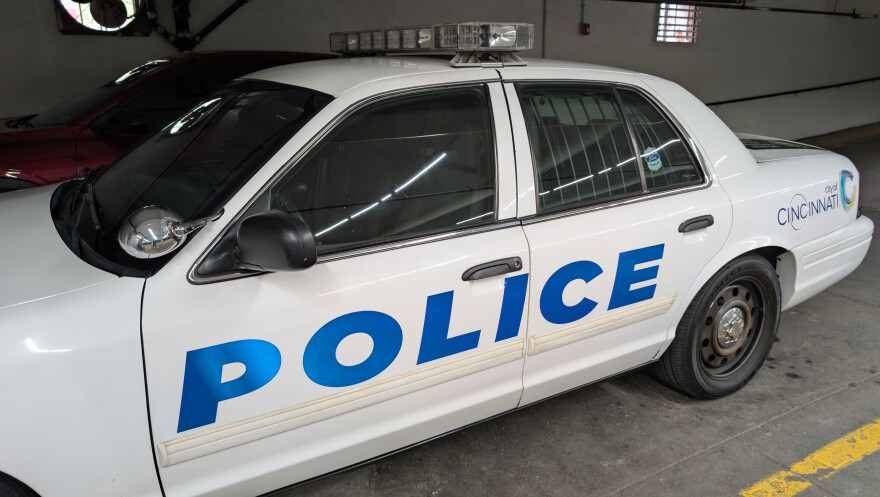 A police car in a garage.