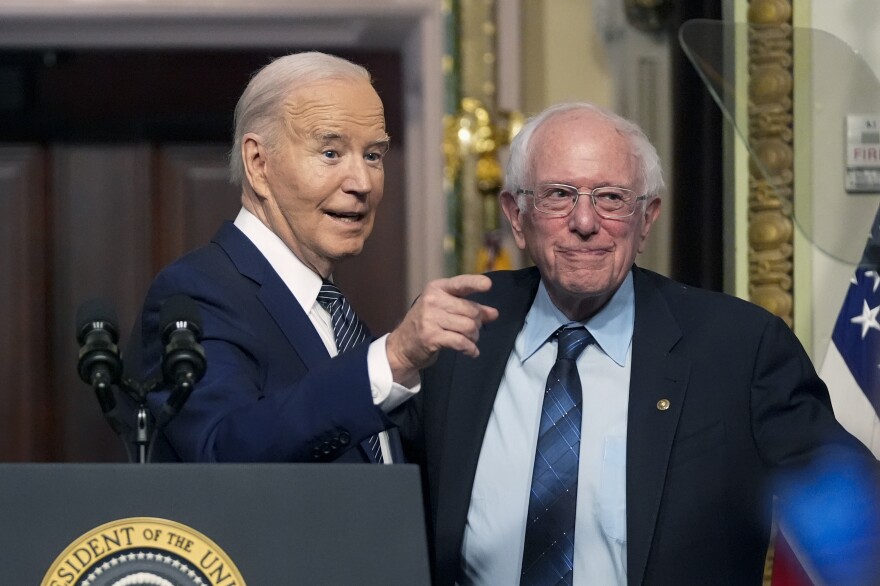 President Biden stands with Sen. Bernie Sanders, I-Vt., on April 3, 2024. Four years ago, Sanders endorsed Biden, and the former rivals worked together to craft policy proposals that bridged Democratic divides.