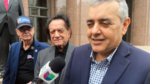 FILE - Former U.S. Rep. David Rivera speaks with media outside a federal court in Miami, Dec. 20, 2022.