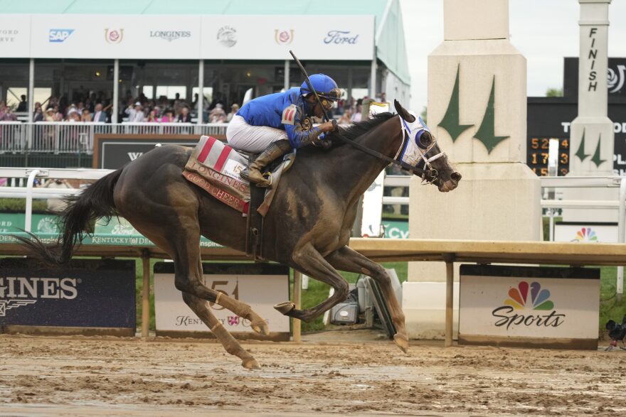 Good Cheer ridden by Luis Saez crosses the finish line to win the 151st running of the Kentucky Oaks horse race at Churchill Downs Friday, May 2, 2025, in Louisville, Ky. (AP Photo/Jeff Roberson)