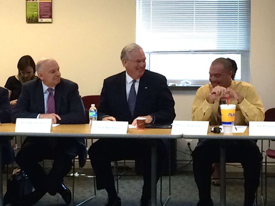 Gov. Jay Nixon, center, listens to an update on efforts to help Riverview Gardens and Normandy at EducationPlus. He is flanked by Riverview Gardens Superintendent Scott Spurgeon, right, and Nixon education adviser Mike Nietzel, left.