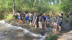 Elementary school students play in the water at the Chickasaw National Recreation Area near Sulphur, Oklahoma. After the state of Oklahoma experienced an extended drought in 2011-2012, officials put together a drought mitigation plan for this region.