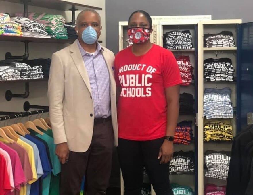 Khisha Asubuhi, owner of Originalitees with a flagship store in Walnut Hills, with AACC CEO Eric Kearney.