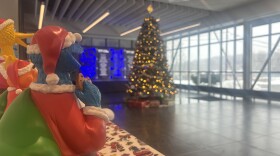 Cookie Monster looks at the WVIA Christmas tree.