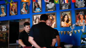 Photos of Venezuelan Miss Universe contestants line a wall at Arempa's restaurant Tuesday, July 14, 2026, in Midvale, Utah.