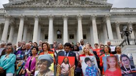 Speaker of the House Nancy Pelosi (D-CA) stands with fellow Democrats holding photographs of the victims of the mass shootings in Buffalo, New York and Uvalde, Texas, before passing the Bipartisan Safer Communities Act in front of the House of Representatives in Washington, DC. 