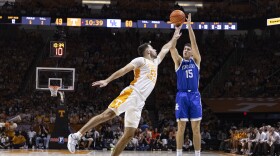 Kentucky guard Reed Sheppard (15) shoots over Tennessee guard Santiago Vescovi (25) during the second half of an NCAA college basketball game Saturday, March 9, 2024, in Knoxville, Tenn. (AP Photo/Wade Payne)