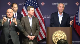 Gov. Asa Hutchinson (at the podium) announcing Sunday that the number of COVID-19 cases in Arkansas had risen to 165.