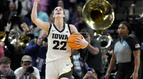 Iowa guard Caitlin Clark (22) celebrates after defeating LSU in an Elite Eight round college basketball game during the NCAA Tournament, Monday, April 1, 2024, in Albany, N.Y. (AP Photo/Mary Altaffer)