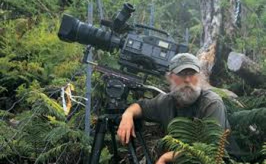Bird cinematographer Tim Barksdale in a dense forest. 