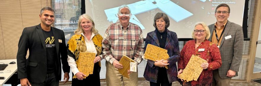 Photo of several WFYI board members in our community room.