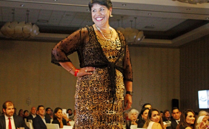 Hermi Forshage models a long leopard dress. She was diagnosed with breast cancer in May 2011.