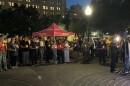 Community members gathering at the vigil for Kerr County flood victims.