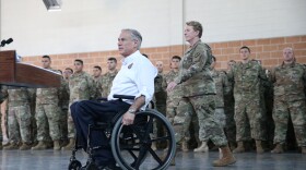 Texas Governor Greg Abbott speaks to the media about security on the Mexico-U.S. border after a briefing with Texas National Guard troops at Sergeant Tomas Garces Texas Army National Guard Armory in Weslaco, Texas, U.S., April 12, 2018. REUTERS/Loren Elliott