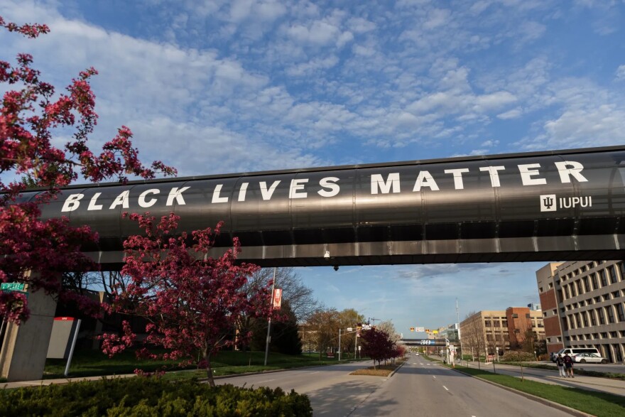 A banner displaying the message "Black Lives Matter" is pictured on a walkway over Michigan Street at IUPUI's campus on April 21, 2022.