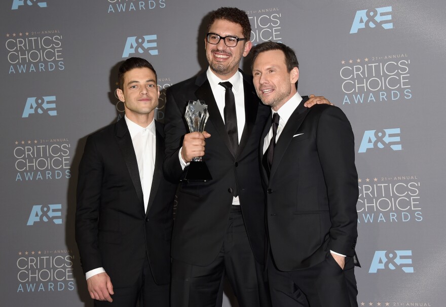 <em>Mr. Robot</em> actor Rami Malek (from left), writer/producer Sam Esmail and actor Christian Slater, at the Critics' Choice Awards in Santa Monica, Calif., in 2016. "Their spirit's in exposing these frauds and abuses by people in power," Esmail says of hacktivists. "And that's just something on a human level I respect."