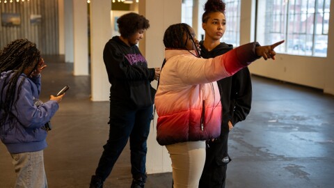 From left to right, Makhai, Genesis, Storm and Bee Puthoff check out the space where their photos will be featured at 78th Street Studios in Cleveland's Gordon Square neighborhood.