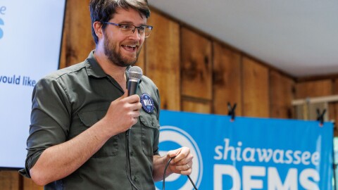 Climate organizer William Lawrence participates in a Democratic congressional candidate forum in Owosso, Mich., on June 25, 2026. Former Ambassador to Ukraine Bridget Brink and former Navy SEAL Matt Maasdam also participated in the forum for Democrats running to take on incumbent U.S. Rep. Tom Barrett, R-Charlotte, in November.