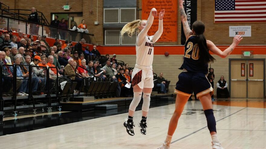 Basketball action in Reed Gym