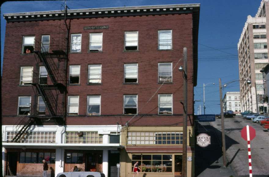 The first Starbucks location at the corner of Virginia St and Western Ave pictured in September 1975. The Rhode Island building, which also housed a tavern and the Harbor Heights Hotel, was demolished in 1977.