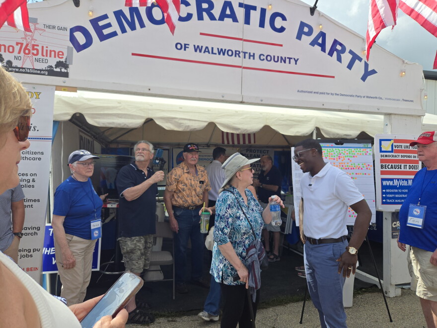 Crowley speaks with Democratic volunteers and voters at the Walworth County Fair.
