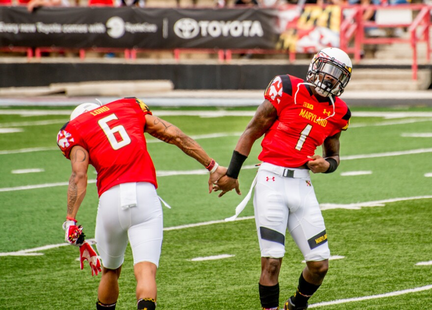  Two Maryland football players.